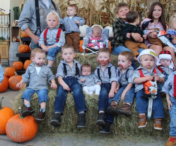 It took a few tries and not every little logger made it into the group photo …but here they are! It was a great turnout on Sunday for the Little Logger Contest 2024. Almost 20 little loggers showed up in their best logging-duds some even with glitter and some brought their little chainsaws. One little logger required real logger Dad support and the little lady logger in pink overalls just had enough and nodded off.
All little loggers got a bag of treats and a Little Logger Lottery drawing selected the winners (it is too hard to judge them). Thanks to Sully’s for the donation of ice cream cone certificates. This event was sponsored by the Forks Forum. Photo Christi Baron