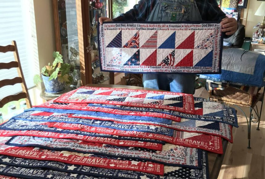 <p>Piecemakers Club member, Martha Paul, donated 20 American Heroes table runners to Forks American Legion Post 106 Commander Bubba Bolin. These patriotic table runners will be gifted to veterans. Bubba, seen here in this photo, shared, “It is an honor to have received those table runners and I will hand them out next week at our Coffee with Comrades on Thursday morning.” Submitted photo</p>