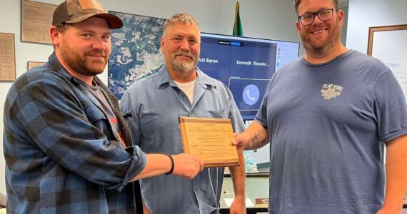 Members of the Tillicum Park board were recognized last Monday evening at the City council meeting for the maintenance and improvements they have made at Tillicum Park. Accepting the award from Forks Mayor Tim Fletcher, center of the photo, are Chris Fletcher (L) and Elliot Mann on the right. Photo Lissy Andros