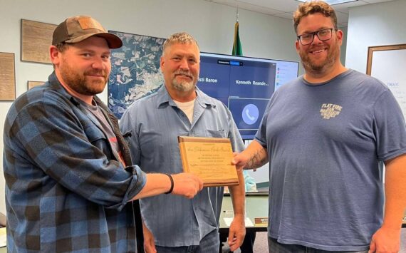 Members of the Tillicum Park board were recognized last Monday evening at the City council meeting for the maintenance and improvements they have made at Tillicum Park. Accepting the award from Forks Mayor Tim Fletcher, center of the photo, are Chris Fletcher (L) and Elliot Mann on the right. Photo Lissy Andros