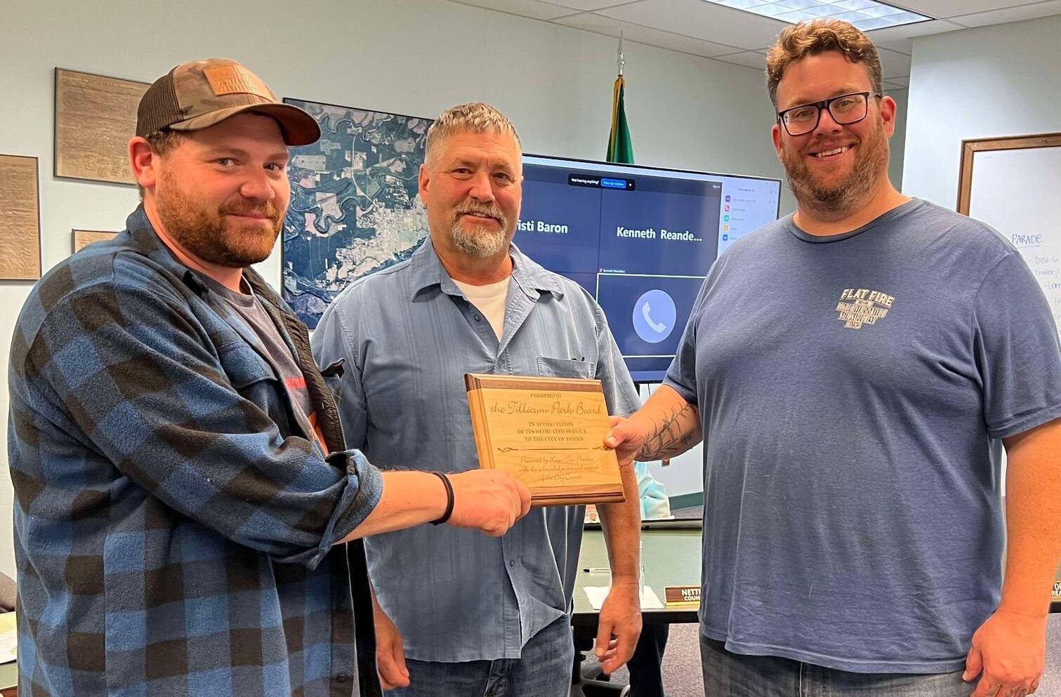 Members of the Tillicum Park board were recognized last Monday evening at the City council meeting for the maintenance and improvements they have made at Tillicum Park. Accepting the award from Forks Mayor Tim Fletcher, center of the photo, are Chris Fletcher (L) and Elliot Mann on the right. Photo Lissy Andros