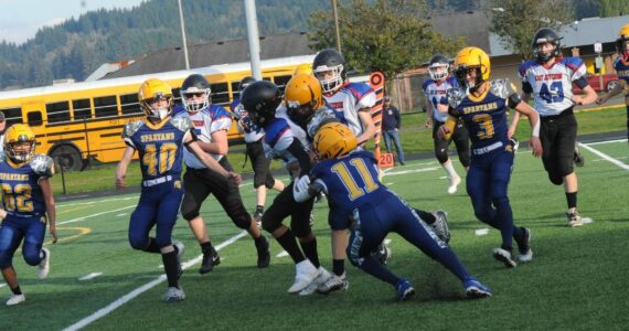 On defense for the Forks Middle School Spartans are from left, Seth Garman, Rigoberto Corrillo-Hernandez, Jonah Miller, unidentified, Pedro Francisco Marcos, Ryder Fletcher, and Tannon Gaydeski. Forks lost this defensive contest to Blue Heron 16 to 8. Photo by Lonnie Archibald