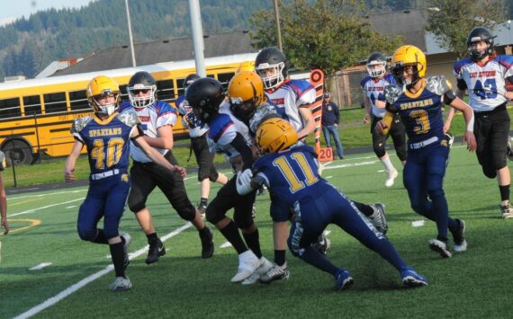 On defense for the Forks Middle School Spartans are from left, Seth Garman, Rigoberto Corrillo-Hernandez, Jonah Miller, unidentified, Pedro Francisco Marcos, Ryder Fletcher, and Tannon Gaydeski. Forks lost this defensive contest to Blue Heron 16 to 8. Photo by Lonnie Archibald