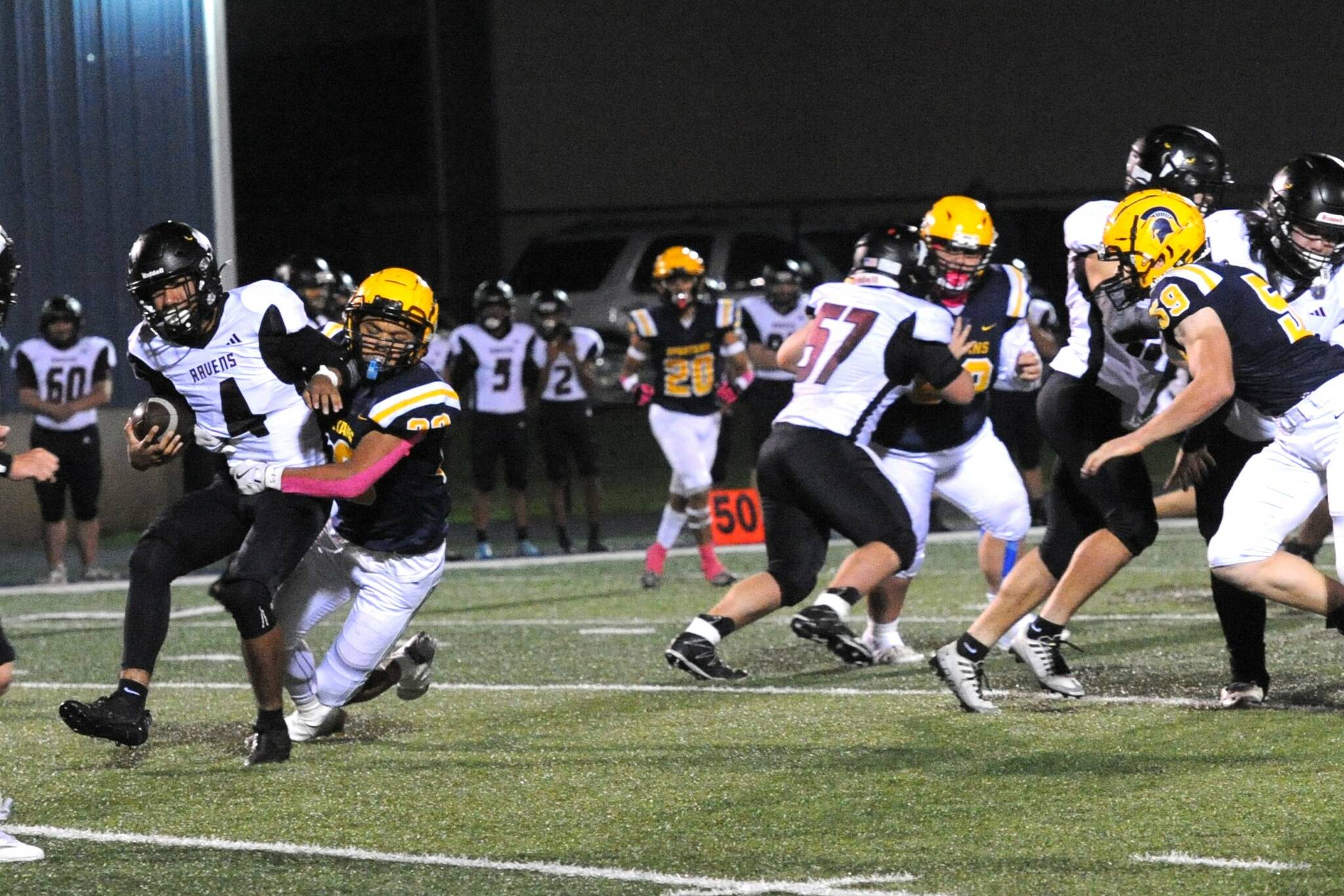 Forks’ Kaden Ward sacks Ravens quarterback Chris Quintana at Spartan Stadium where a stinger Forks defense played a big role in defeating Raymond-South Bend 35 to 8. Story page 6. Photo by Lonnie Archibald