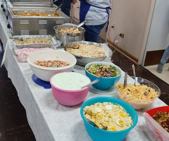 Volunteers were ready for hungry community members as the 89th annual Harvest Dinner was just ready to get underway earlier last month. Pastor Warren Johnson reported that well over 300 meals were served.
The proceeds from this dinner help out with the cost of the nonprofit groups that meet at the church, which are many. Photo Ron Miller