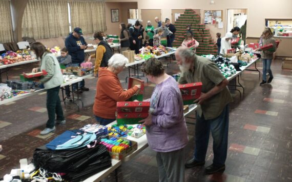 Good Samaritan Foundation representatives and local volunteers gathered at the Congregational Church fellowship hall, filling 475 shoeboxes for the Operation Christmas Child program. The team, which included Deborah and Marty Dillion with Don Lawley, completed their work in just two hours on Saturday morning. These shoeboxes, packed with care and Christmas joy, will bring smiles to children around the world. Photo Deborah Dillon