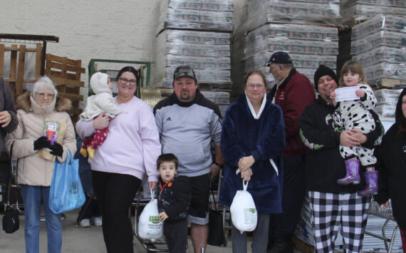 West End Business & Professional Association held its second Turkey Drawing of the season on Saturday outside Forks Outfitters. Winners of turkeys were Sarah Warner, Lori Christenson, and Nani Gomez. Winning Sully’s gift certificates were Christa Baker, Tony Porter, and Hailey Hayden; Cathy Harner won Sasquatch coffee products from the Sasquatch the Legend store. Remember to ask for blue tickets when you shop locally. Bring them to Outfitters on Saturdays for the 1 p.m. drawings. Nov. 23 will be the last of the Turkeys and then Santa Bucks will be awarded Nov. 30, Dec. 7, 14, and 21.
Also, remember to purchase your tickets for the WEBPA $500 shopping spree which will be drawn on Dec. 21. Winner need not be present for the Shopping Spree prize.
Happy winners pose here with their family members! Photo Christi Baron