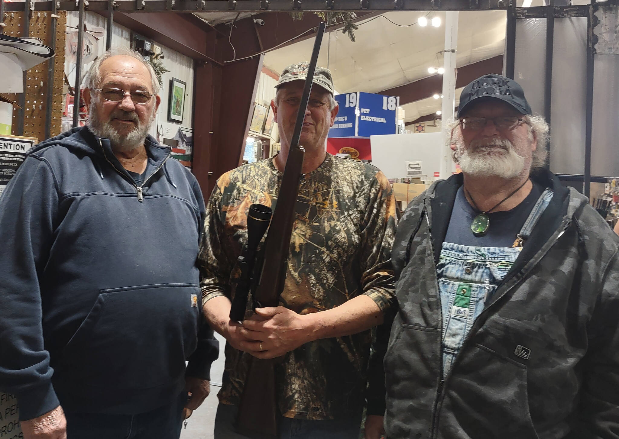 There were smiles all around on Saturday, December 7, when Forks American Legion Post 106 held the drawing for its annual Rifle Raffle fundraiser. Pictured left to right are: Howard Goakey, Post financial officer; Mark Rabin, the raffle winner; and Bubba Bolin, Post commander. Post 106 member Joe Wright congratulated Rabin on his new hunting rifle and thanked him for his support.
Submitted photo