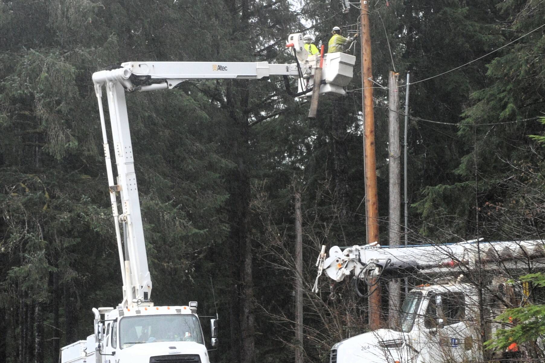 The Clallam County Public Utility District made repairs to power lines after the wind blew trees and limbs into electrical wires and poles near Three Rivers Saturday morning. The Clallam County County Road Department also removed a tree from the Quillayute Road early Saturday morning. 
Photo by Lonnie Archibald