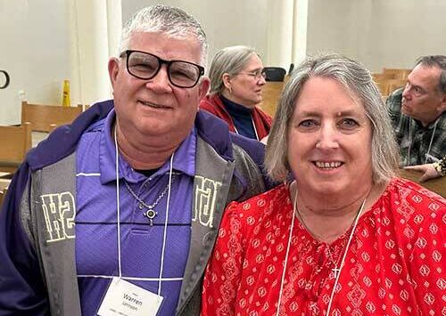 Warren Johnson is with his wife Cathy at the annual meeting.