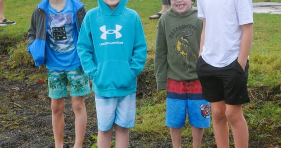 Photo by Lonnie Archibald
All smiles before …Several youngsters were amongst those who took to the waters at Lake Pleasant Clallam County Park on New Year’s morning. Pictured here are just a few of those who were ready to take the plunge braving the cool waters.