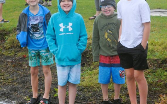 Photo by Lonnie Archibald
All smiles before …Several youngsters were amongst those who took to the waters at Lake Pleasant Clallam County Park on New Year’s morning. Pictured here are just a few of those who were ready to take the plunge braving the cool waters.