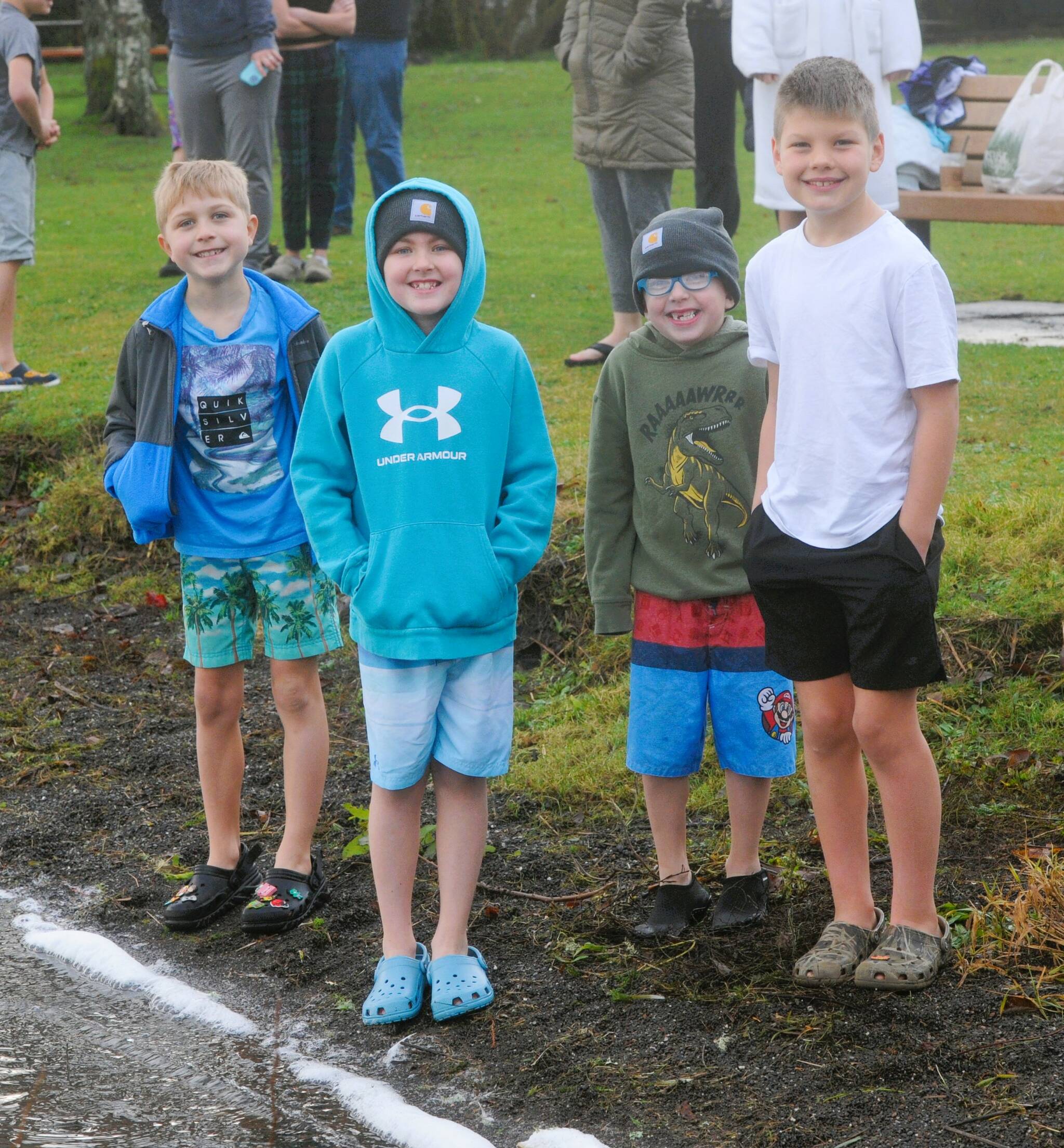 Photo by Lonnie Archibald
All smiles before …Several youngsters were amongst those who took to the waters at Lake Pleasant Clallam County Park on New Year’s morning. Pictured here are just a few of those who were ready to take the plunge braving the cool waters.