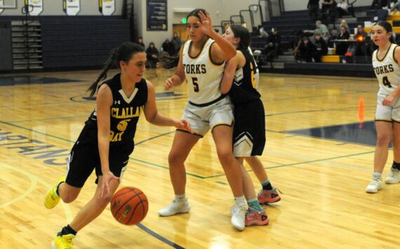 Photo by Lonnie Archibald
Bruin Kaleeka Mendoza McCarty drives around Spartan Peril Salazar while Bruin Helen Smathers sets a screen. Looking on is Spartan Kylie Hull (4). The Forks JV’s defeated Clallam Bay 37 to 23 prior to the Forks vs Ilwaco game January 6 in the Spartan Gym.