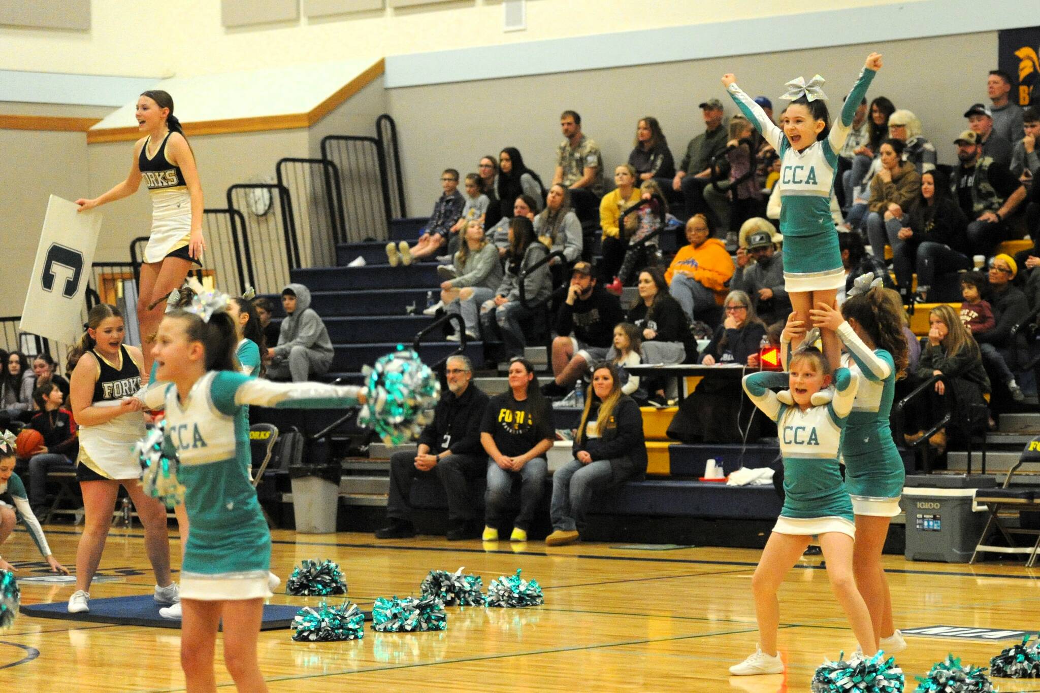 CCA performs some stunts at halftime in the Spartan Gym.