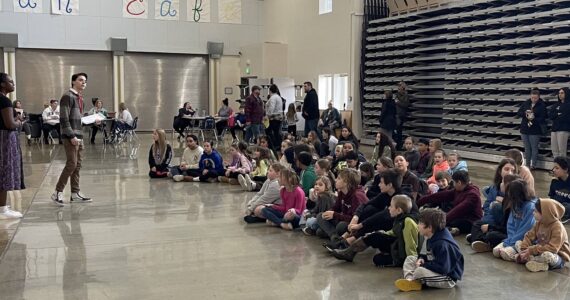 Missoula Children’s Theater staff address play-hopefuls on Monday in the Forks High School Commons. Photo Christi Baron