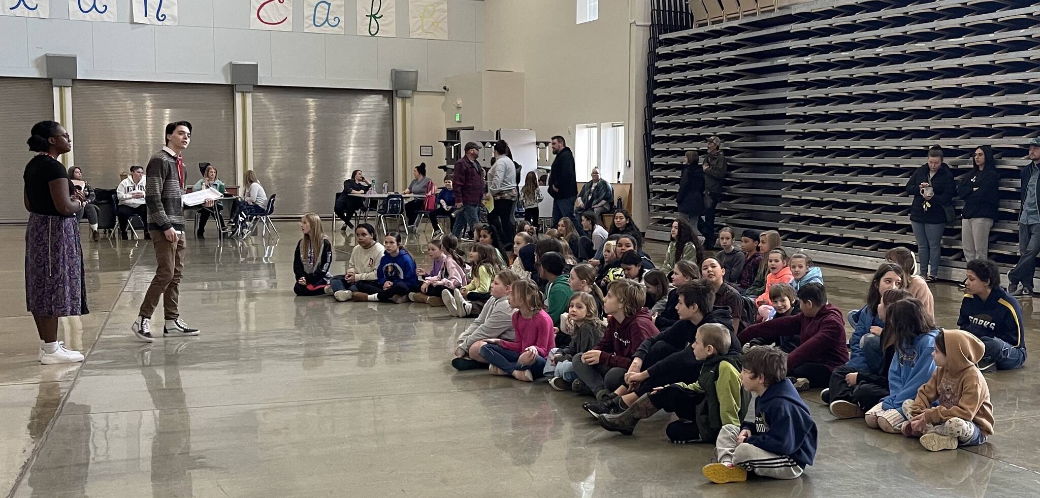 Missoula Children’s Theater staff address play-hopefuls on Monday in the Forks High School Commons. Photo Christi Baron