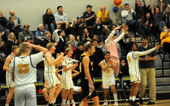 Photo Lonnie Archibald
Forks began celebrating when the final horn sounded giving the Spartans a win and the PAC 2B league championship as they defeated North Beach Friday night Jan. 31 at home. Among the group are seniors Kyle Lohrengel (1) and DeAnthony Davila (3). Spartan seniors were also honored during the game. More photos page 3.