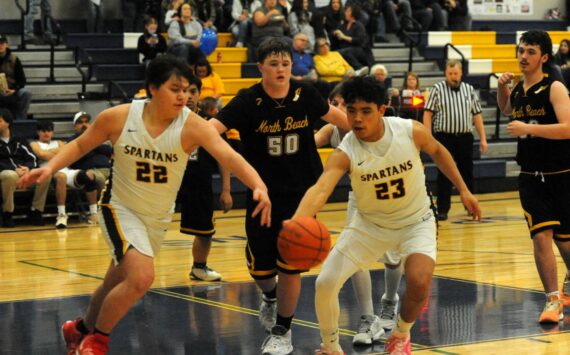 Photo by Lonnie Archibald
In Spartan JV action David Ward (22) and Kaden Ward (23) competed for ball control against North Beach who Forks defeated 68 to 30 in the Spartan Gym.