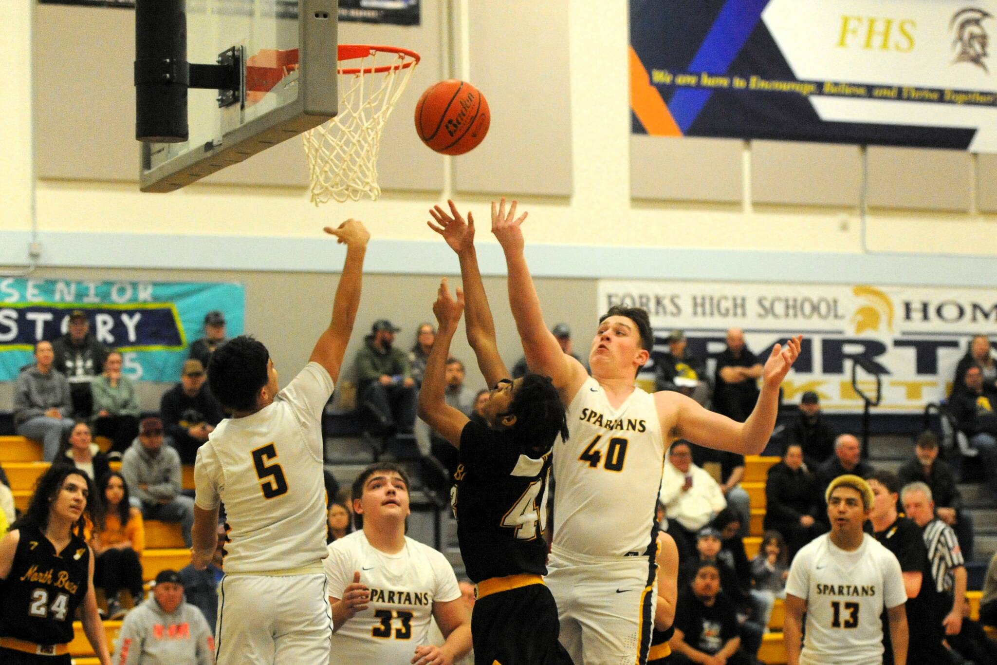 Photo by Lonnie Archibald
Spartan Jv’s rebounding against the Hyaks are from left, Cash Barajas (5), Logan Ramsey (33), Radly Bennett (40), and Carlos Soto (13). This was their last home game of the season.