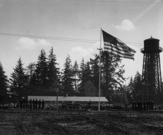 <p>Dobyns collection</p>
                                <p>The Naval Auxiliary Air Station (NAAS) Quillayute was dedicated in 1944. The station was used as a training center and coastal patrol station during World War II. Photo of the dedication day.</p>