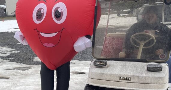 Photo Christi Baron
You never know what Jessica Hurley will do for Valentine’s Day or any other holiday for that matter. But, she was out dressed as a smiling heart and spreading happiness and handing out treats last Friday. Her husband Titus was doing the driving as she had to deflate/inflate a bit each time she got in and out of the golf cart.