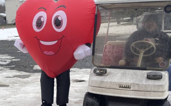 Photo Christi Baron
You never know what Jessica Hurley will do for Valentine’s Day or any other holiday for that matter. But, she was out dressed as a smiling heart and spreading happiness and handing out treats last Friday. Her husband Titus was doing the driving as she had to deflate/inflate a bit each time she got in and out of the golf cart.