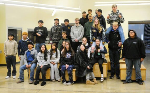 Forks wrestlers pose for photos before departing to Tacoma last Thursday for the 2B state championships. Photo by Lonnie Archibald