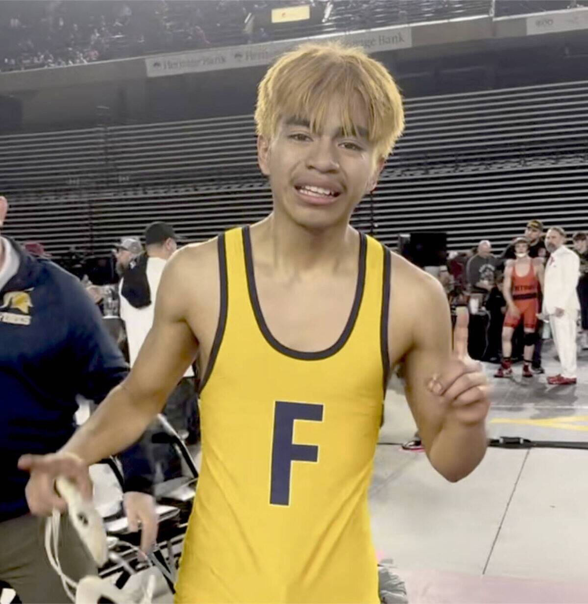 Forks’ Abraham Montealegre celebrates his state championship at 110 pounds at the Tacoma Dome on Saturday. Montealegre is part of a long line of Forks state champions in wrestling. (Courtesy of Kyle Weakley)