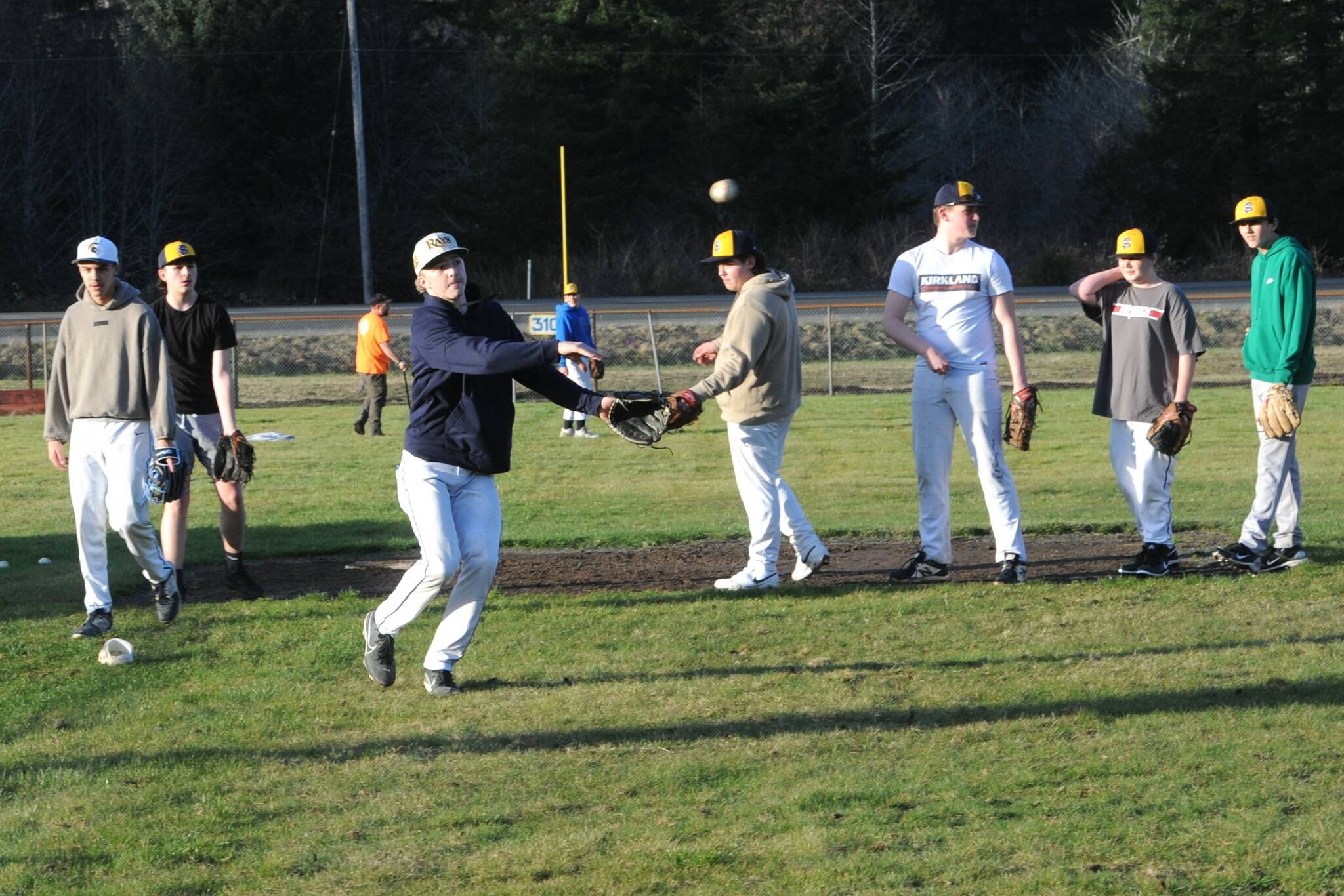 Photo by Lonnie Archibald
Spartan Landen Olson makes the throw to first as pitchers and infielders practice at the Fred Orr Memorial Fields in Beaver. Forks is scheduled to play Kingston Saturday March 15 at 1 p.m. here in Beaver.